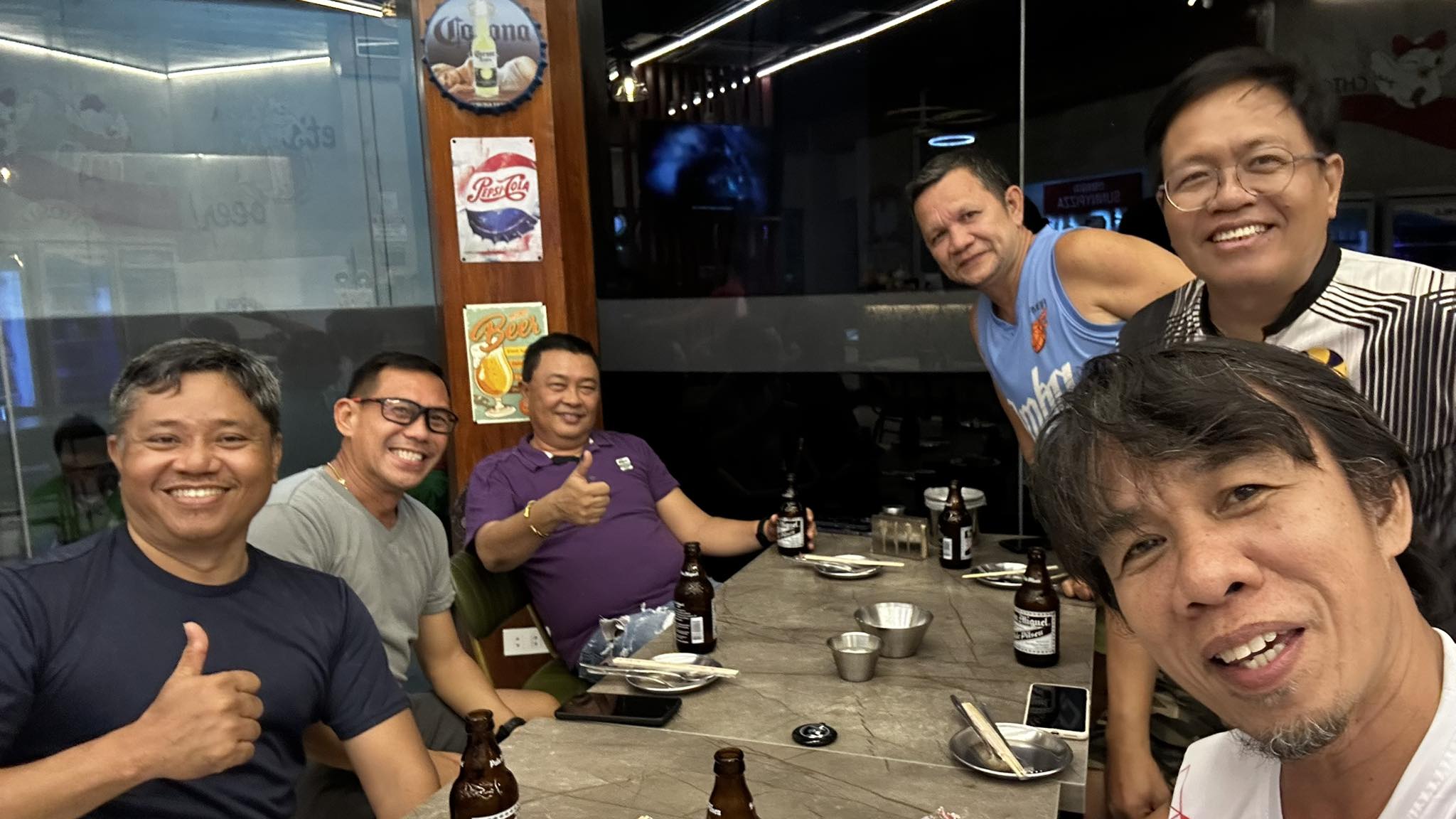 Brothers gathered around a table after play