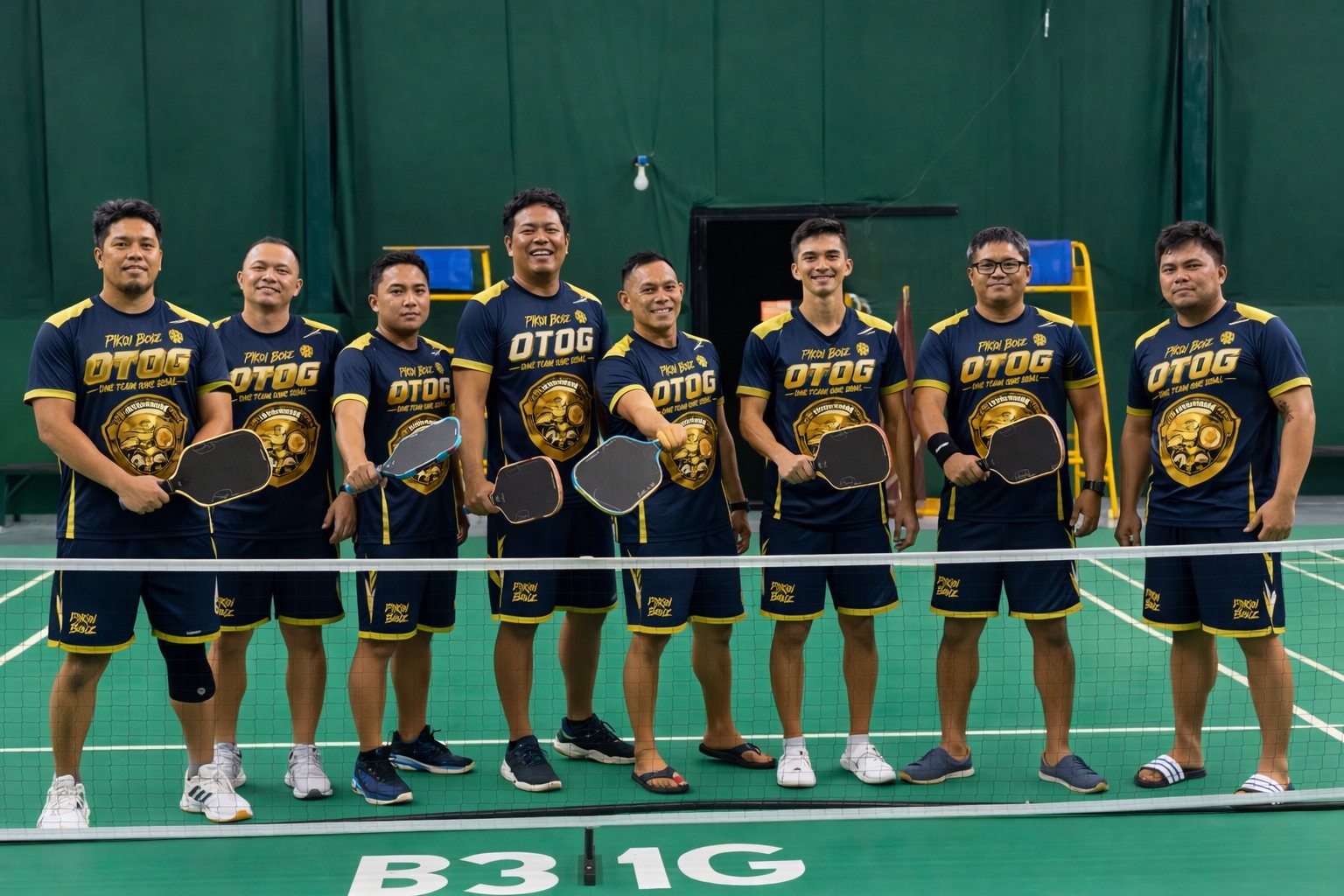 The OTOG pickleball team in their navy and gold uniforms at the net